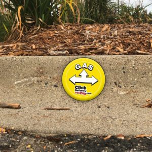 Rhino Durathane Marker on roadside curb saying Gas followed by Click Before You Dig .com
