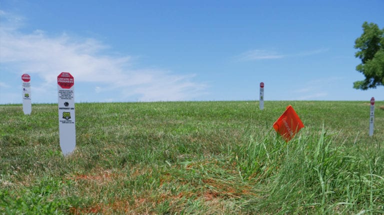 Locate in progress signs in a field