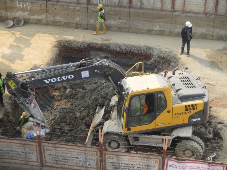 crew digging with machine to put new utilities underground